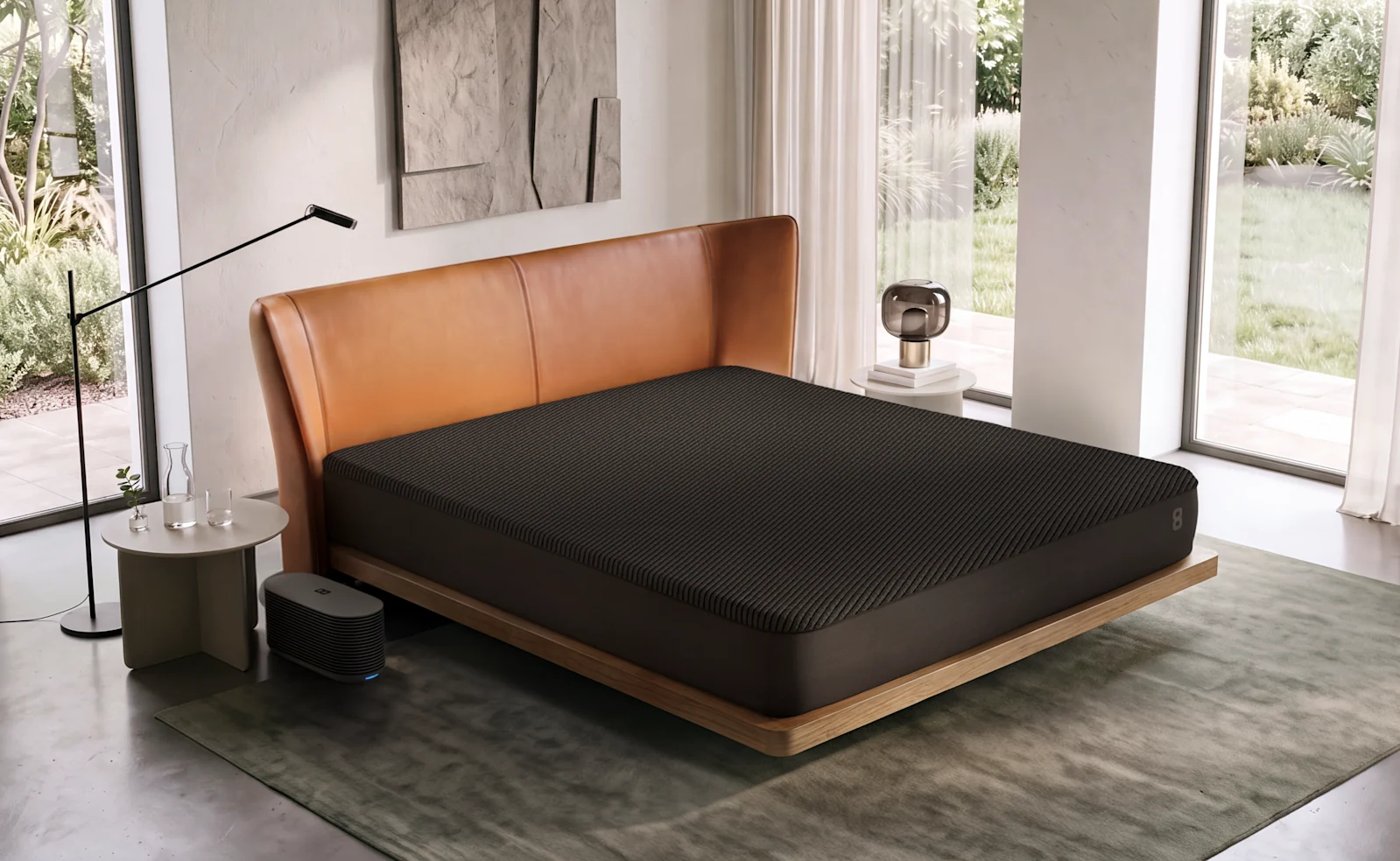 Eight Sleep Pod 6 Cover on a bed in a bright bedroom, with its Hub beside the bed